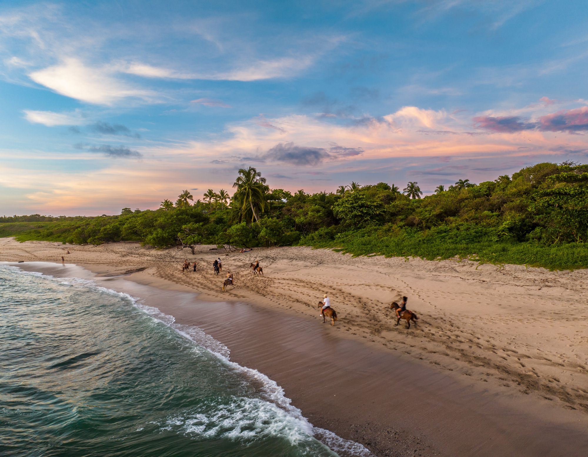 Group horseback ride at villa